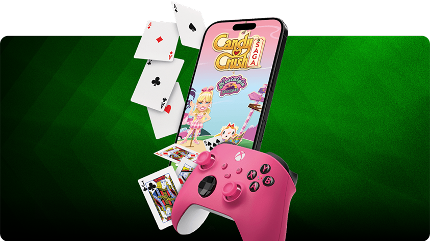 Pink XBOX controller in front of a smartphone displaying the Candy Crush Saga game screen, with playing cards scattered around, all set against a green diagonal-striped background.