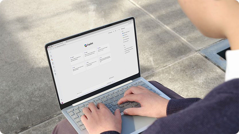 person on laptop visiting Copilot